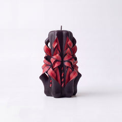 Dark red patterned handmade candles