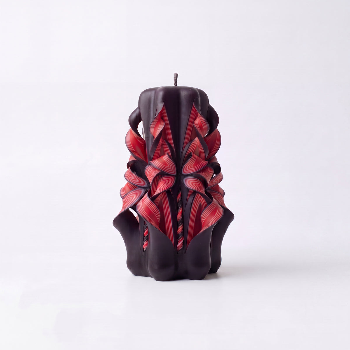 Dark red patterned handmade candles