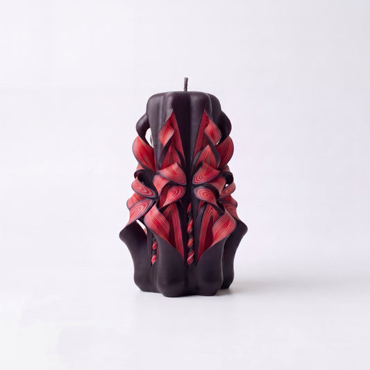 Dark red patterned handmade candles